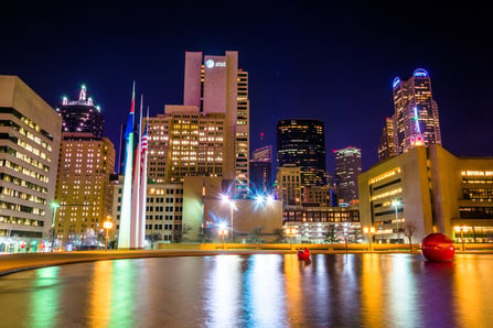 The Dallas skyline and the reflecting pool at City Hall at night, in Dallas, Texas.-1